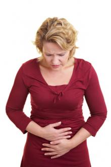 mature woman stomachache.jpg